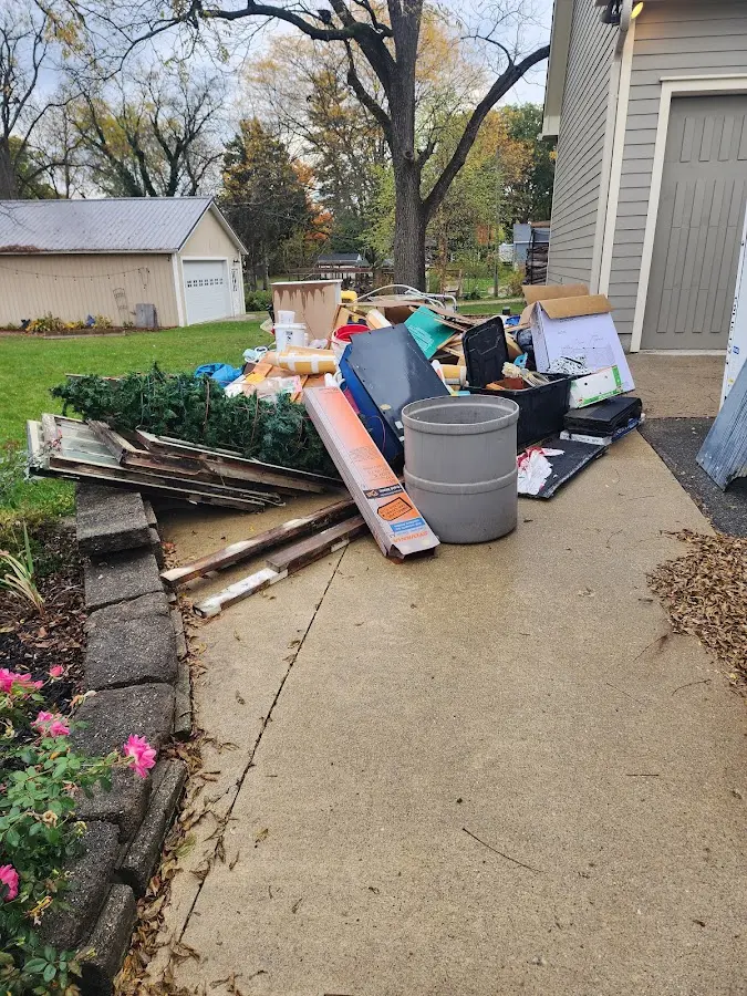 Dumpster being loaded with debris for Residential Dumpster Rental in Glendive
